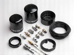 Selection of new car parts on a clean surface.
